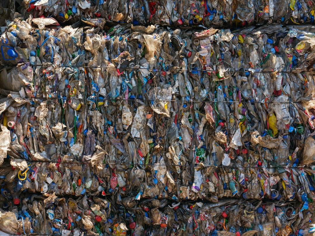Waste sorting and recycling facility with piles of material